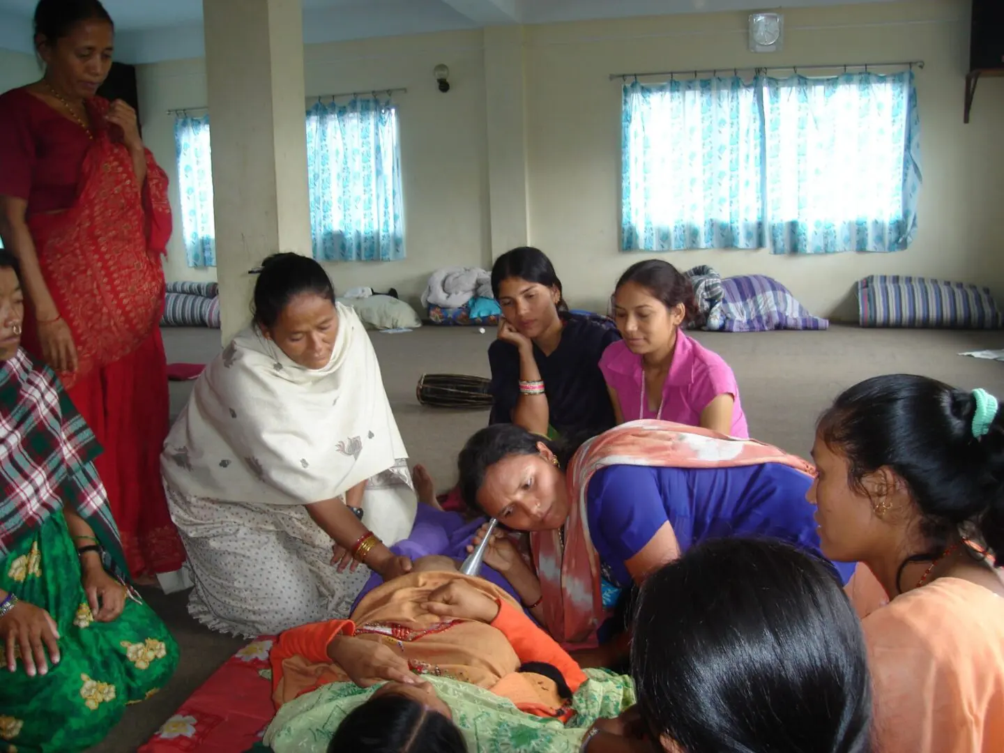 A group of women sitting around in a room.